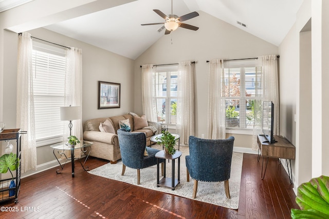 living room with high vaulted ceiling, hardwood / wood-style flooring, a ceiling fan, baseboards, and visible vents