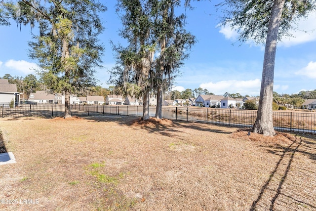 view of yard with a residential view and fence