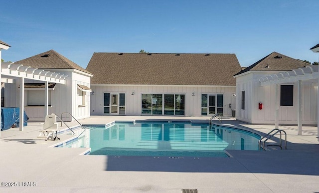 pool with a pergola and a patio area