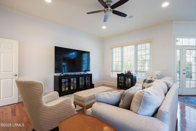 living room with recessed lighting, wood finished floors, and crown molding