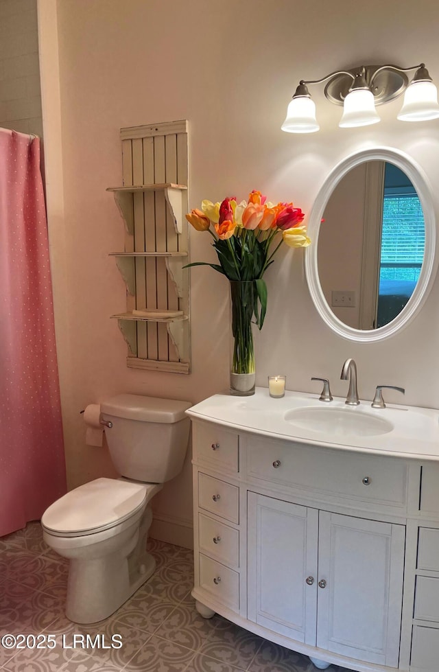 bathroom with vanity, tile patterned flooring, toilet, and a shower with curtain