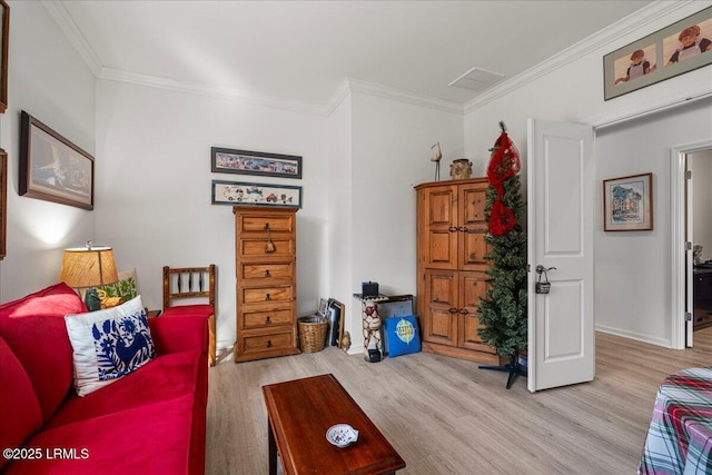 living room featuring light hardwood / wood-style flooring and ornamental molding