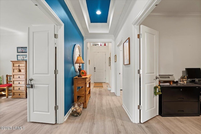 hallway featuring ornamental molding and light hardwood / wood-style flooring