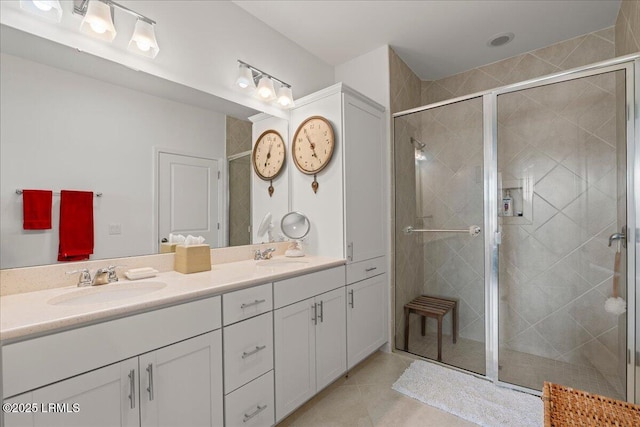 bathroom with vanity, tile patterned flooring, and a shower with shower door