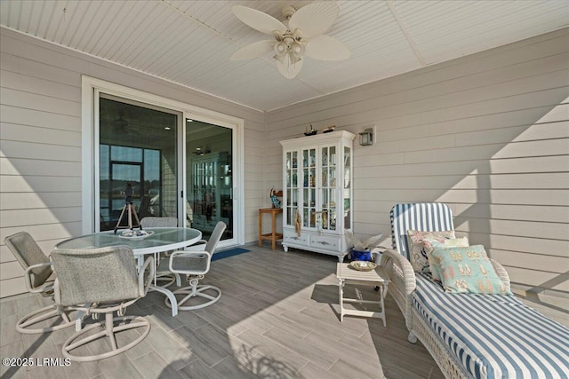 wooden terrace with ceiling fan and french doors