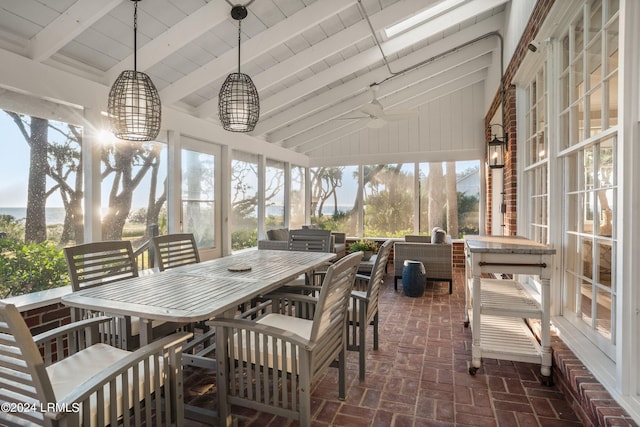 sunroom with ceiling fan, wooden ceiling, and vaulted ceiling with beams