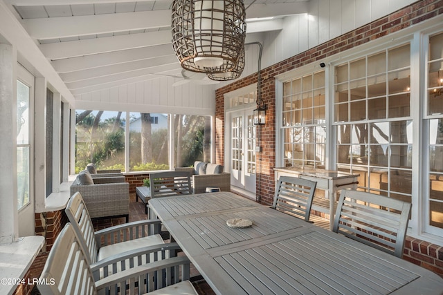 sunroom with wood ceiling and lofted ceiling