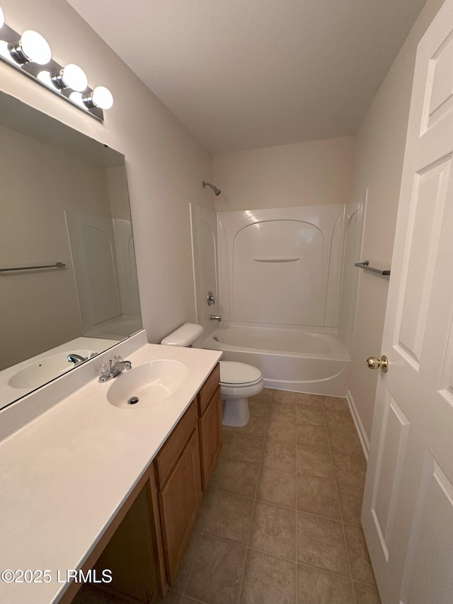 bathroom featuring shower / bathing tub combination, vanity, toilet, and tile patterned floors