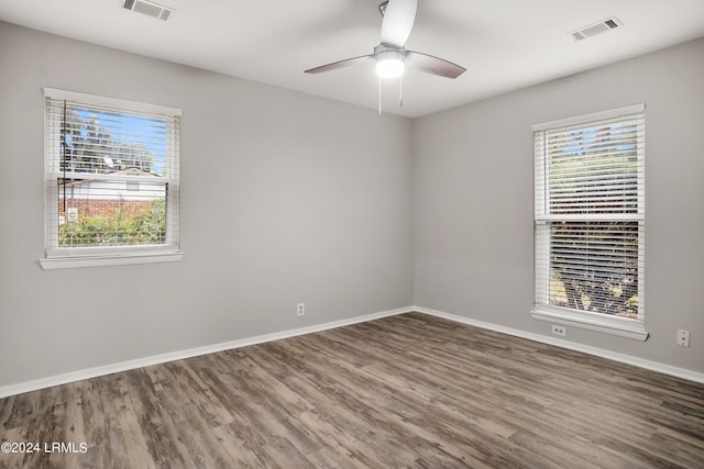 empty room featuring hardwood / wood-style flooring and ceiling fan