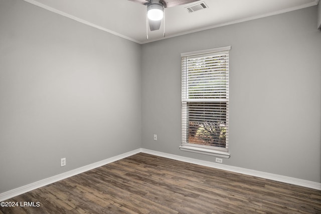 spare room with ornamental molding, dark hardwood / wood-style floors, and ceiling fan