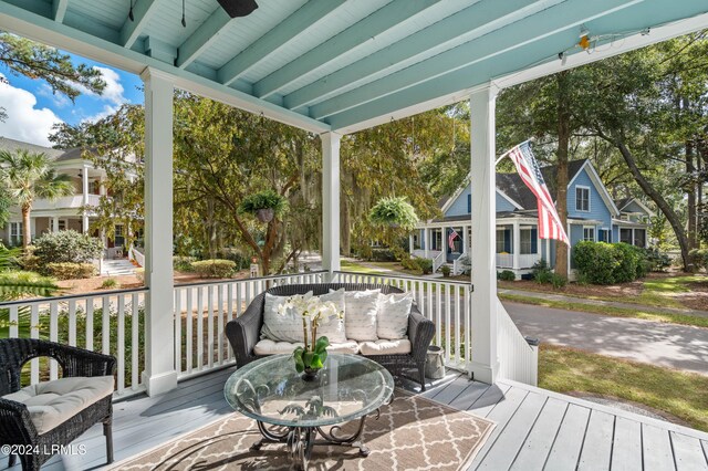 wooden deck featuring ceiling fan