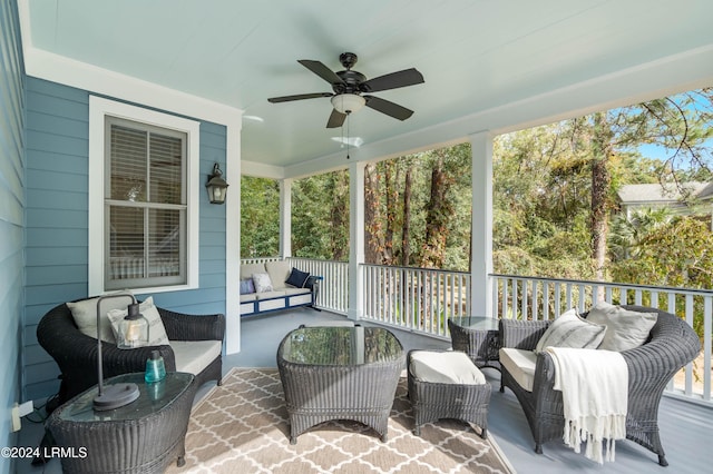 sunroom / solarium featuring ceiling fan