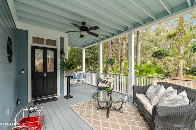 deck featuring ceiling fan and an outdoor hangout area