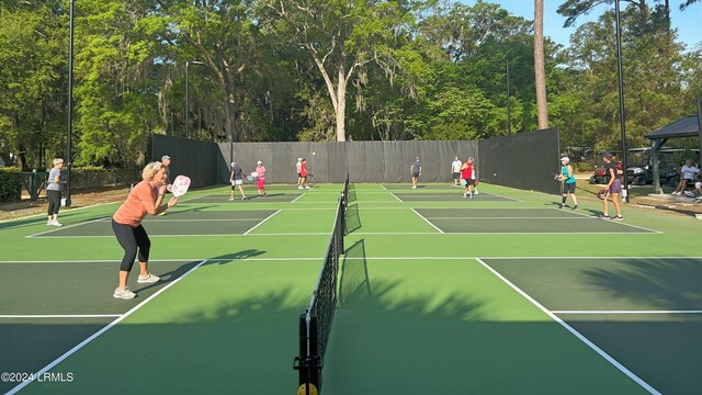 view of tennis court featuring basketball court