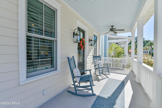 view of patio featuring ceiling fan and a porch