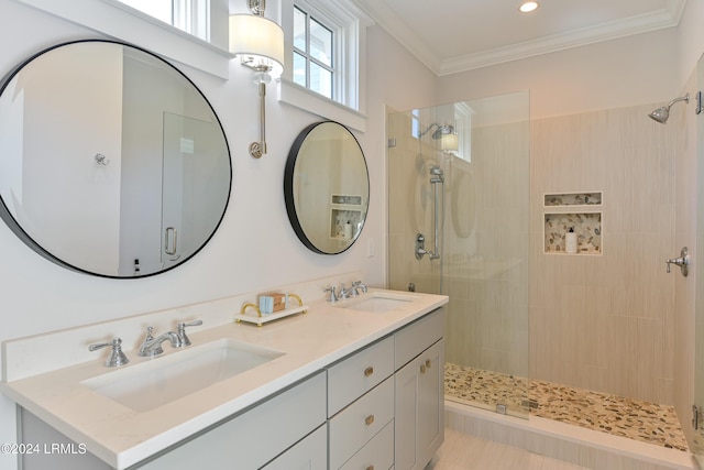 bathroom featuring vanity, tiled shower, and ornamental molding