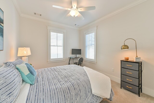 carpeted bedroom with crown molding and ceiling fan