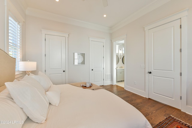 bedroom featuring ceiling fan, crown molding, connected bathroom, and dark hardwood / wood-style flooring