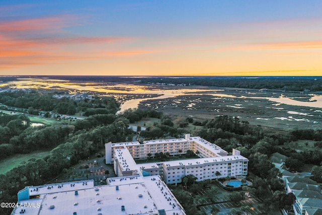 aerial view at dusk with a water view