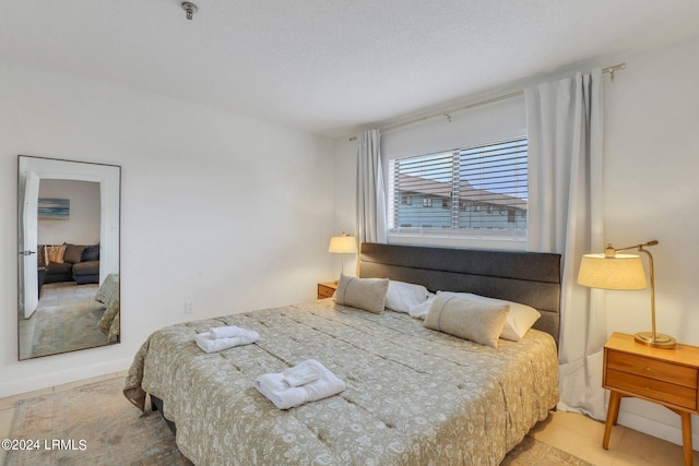 bedroom featuring a textured ceiling