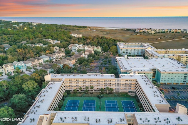 aerial view at dusk with a water view