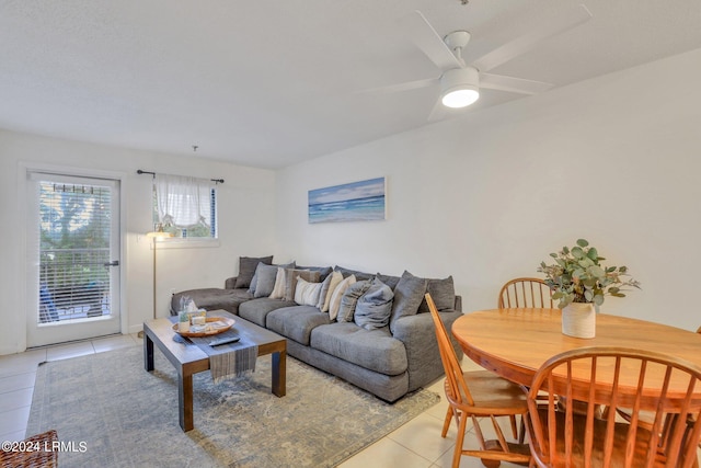 living room featuring light tile patterned floors and ceiling fan