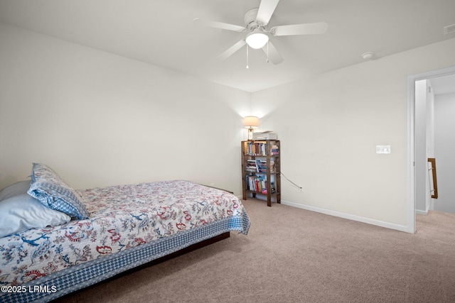 carpeted bedroom with visible vents, ceiling fan, and baseboards