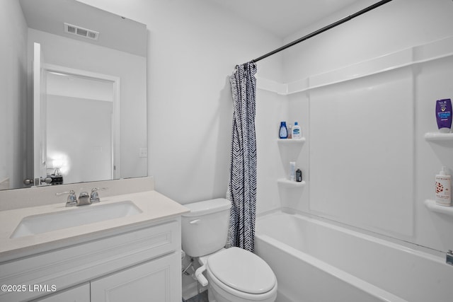 bathroom featuring toilet, shower / bath combo, visible vents, and vanity