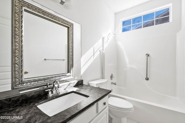 bathroom featuring shower / tub combination, toilet, and vanity