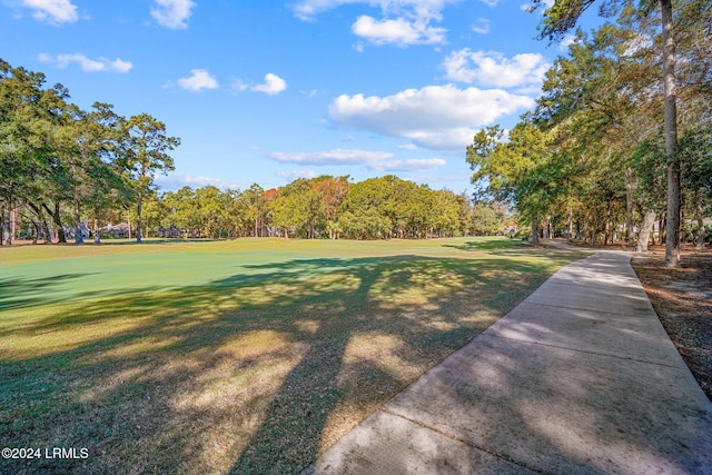 surrounding community featuring a lawn