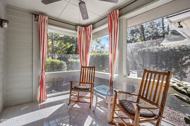 sunroom featuring plenty of natural light and ceiling fan