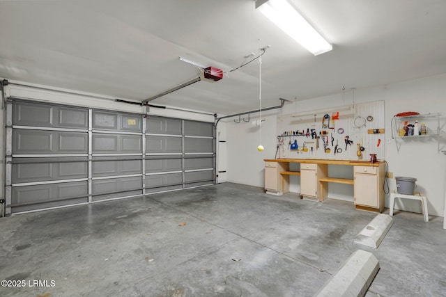 garage featuring a workshop area and a garage door opener