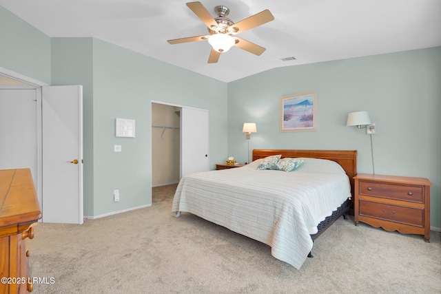 bedroom with carpet, baseboards, vaulted ceiling, visible vents, and a closet