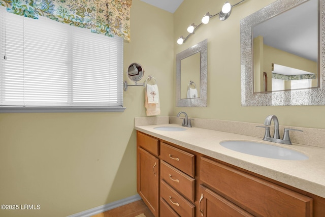 full bathroom featuring double vanity and a sink