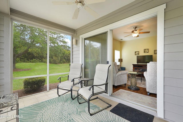 sunroom / solarium with ceiling fan