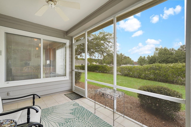 sunroom / solarium featuring ceiling fan