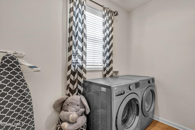 128 Colvin Dr, Okatie, SC 29909 - washroom with laundry area, washing machine and clothes dryer, baseboards, and light tile patterned floors