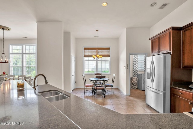 128 Colvin Dr, Okatie, SC 29909 - kitchen with a chandelier, stainless steel refrigerator with ice dispenser, visible vents, a healthy amount of sunlight, and a sink