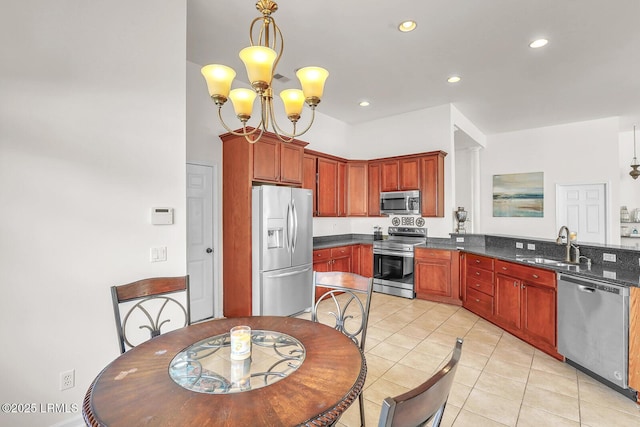 128 Colvin Dr, Okatie, SC 29909 - kitchen with pendant lighting, light tile patterned floors, appliances with stainless steel finishes, a sink, and dark countertops