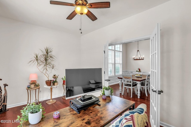 128 Colvin Dr, Okatie, SC 29909 - living room featuring baseboards, wood finished floors, and ceiling fan with notable chandelier