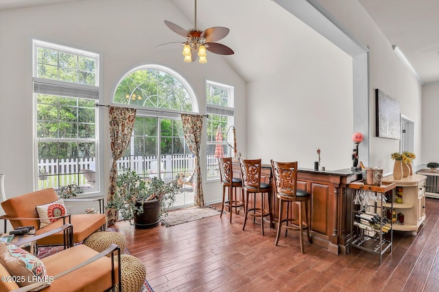 128 Colvin Dr, Okatie, SC 29909 - dining area featuring crown molding, a bar, ceiling fan, high vaulted ceiling, and wood finished floors