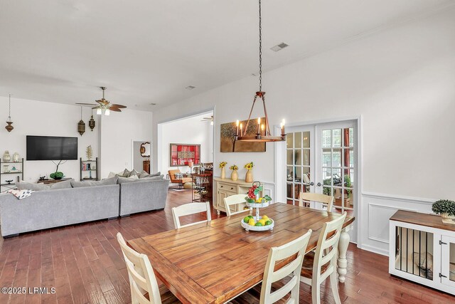 128 Colvin Dr, Okatie, SC 29909 - dining area featuring visible vents, wainscoting, hardwood / wood-style flooring, and ceiling fan with notable chandelier
