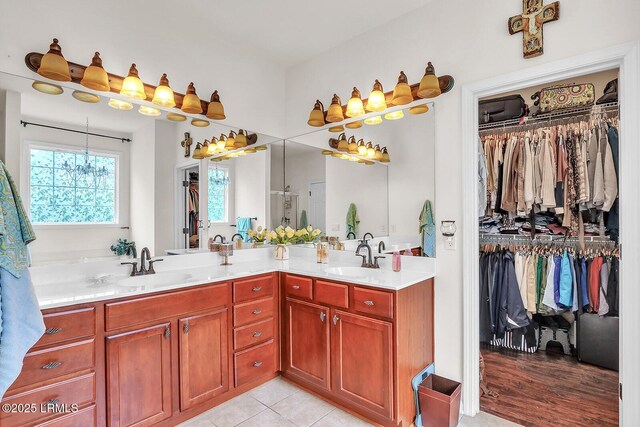 128 Colvin Dr, Okatie, SC 29909 - full bathroom with a spacious closet, tile patterned flooring, double vanity, and a sink