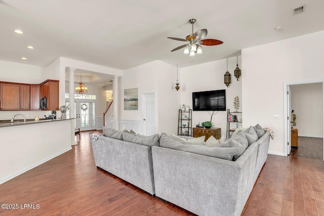 128 Colvin Dr, Okatie, SC 29909 - living area featuring visible vents, decorative columns, recessed lighting, ceiling fan with notable chandelier, and wood-type flooring