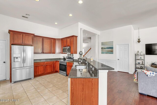 128 Colvin Dr, Okatie, SC 29909 - kitchen with dark stone counters, a peninsula, recessed lighting, appliances with stainless steel finishes, and a sink