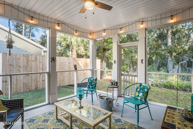 sunroom / solarium featuring a wealth of natural light and ceiling fan