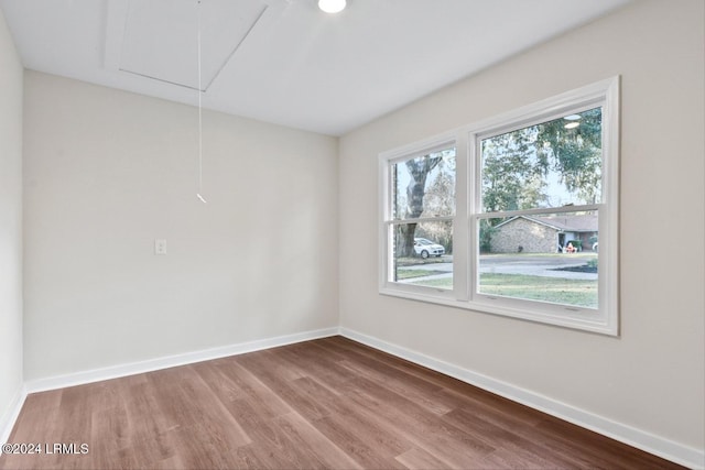 spare room with hardwood / wood-style flooring