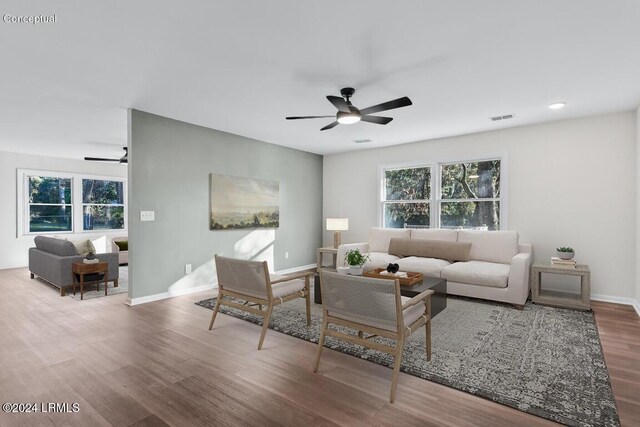 living room with hardwood / wood-style floors and ceiling fan