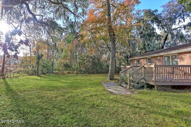 view of yard with a wooden deck