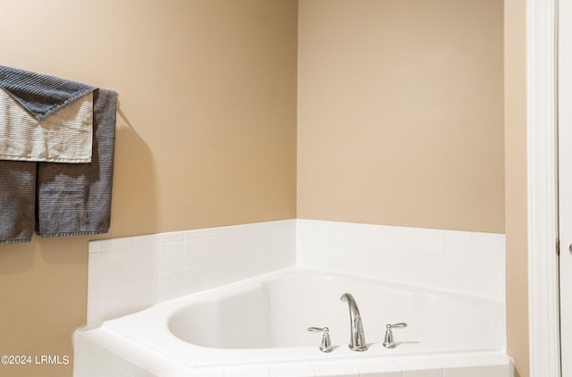 bathroom with tiled tub